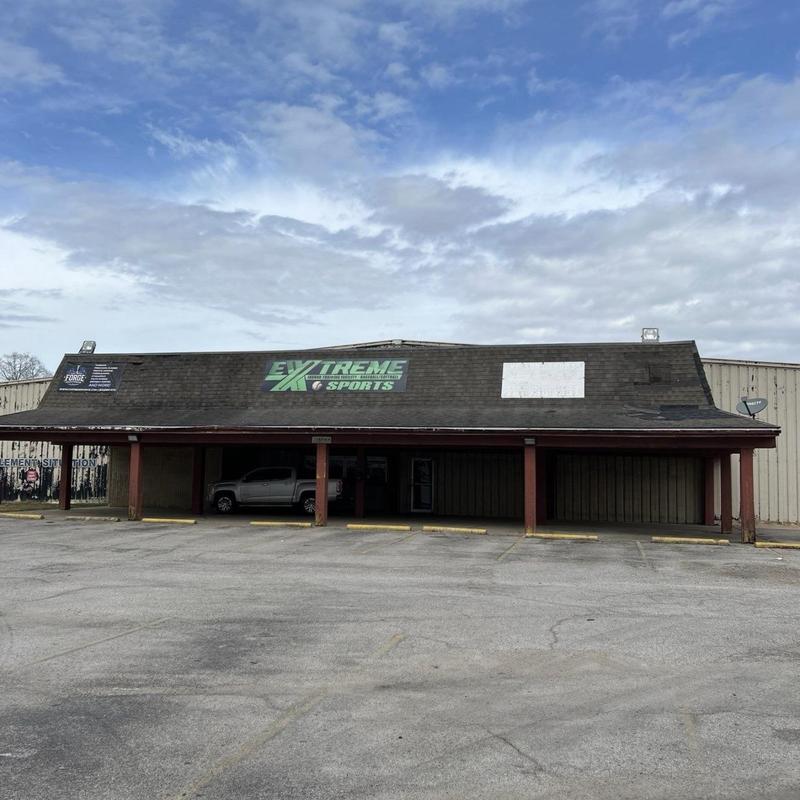 Asphalt shingle roof with visible wear and damage