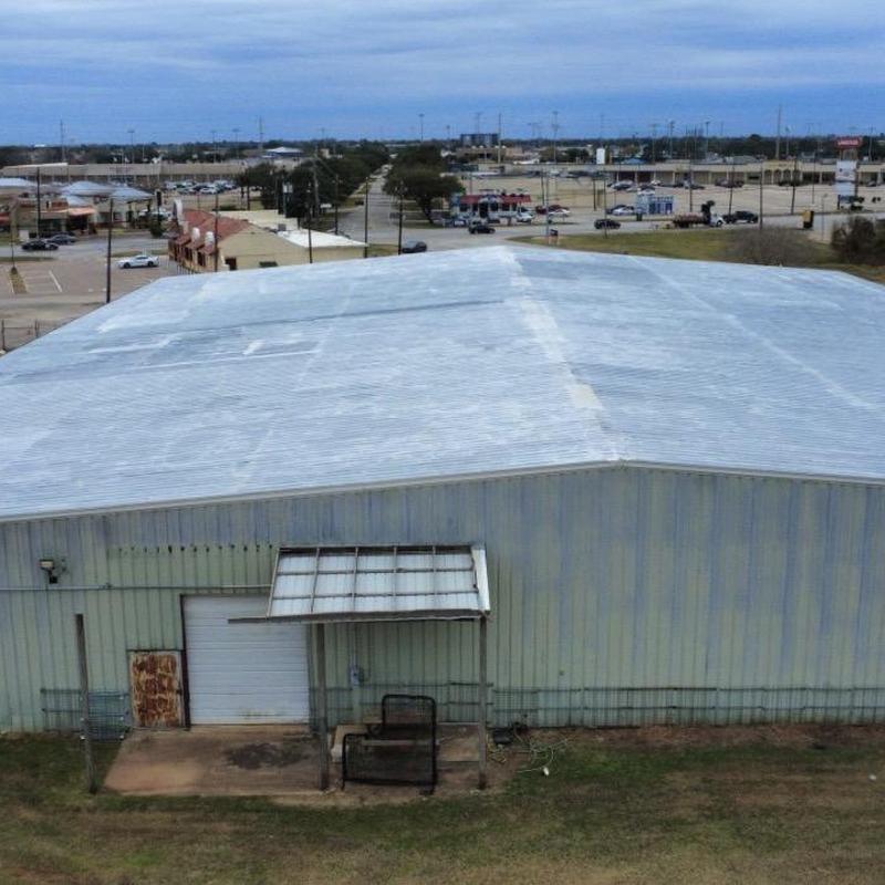 Metal roofing panels with visible seam repairs