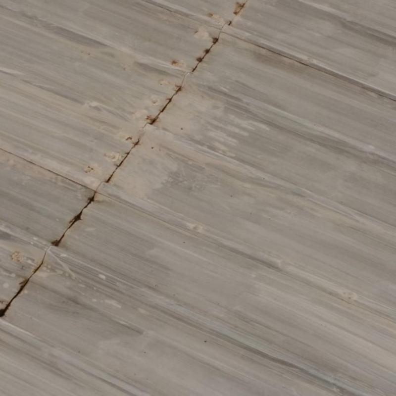 Metal roofing panel seam with rust and sealant failure