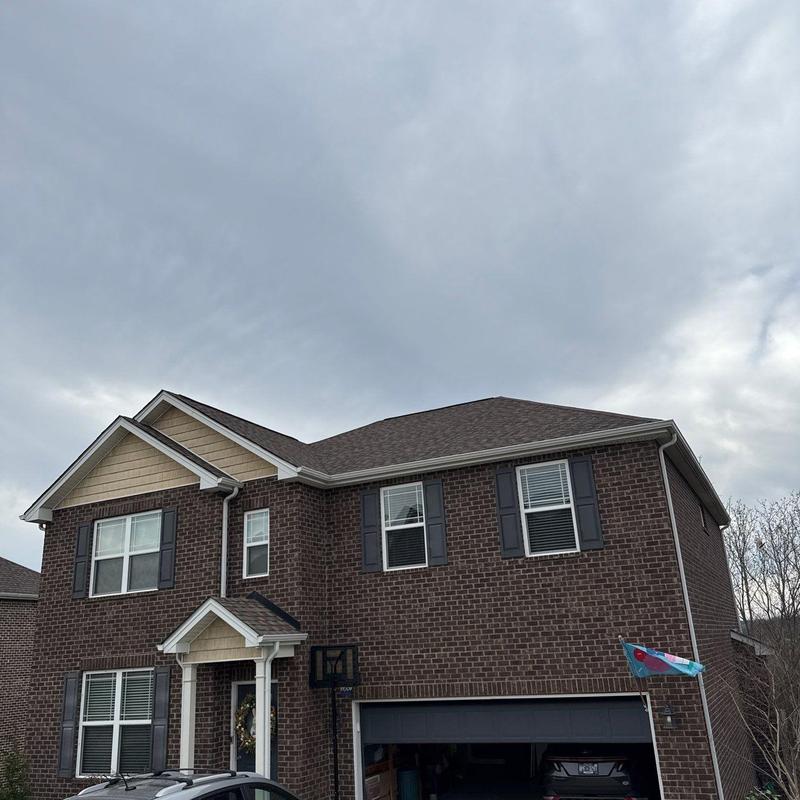 Asphalt shingle roof with hail damage inspection