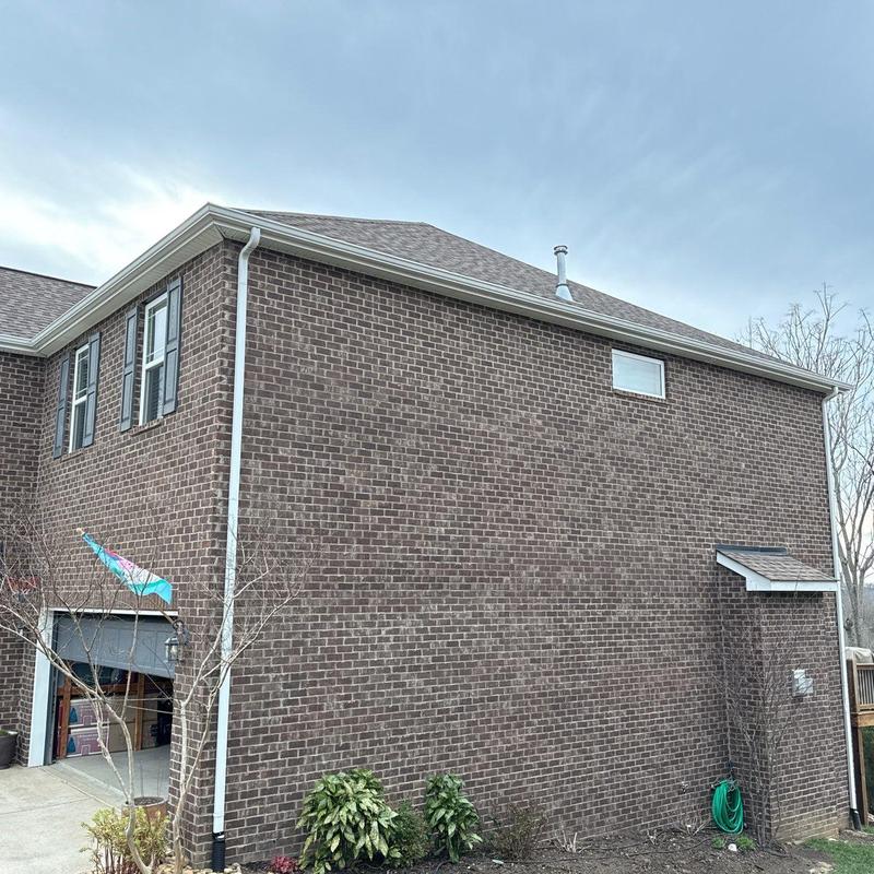 Asphalt shingle roof with ridge cap and flashing inspection