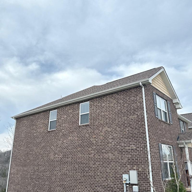 Asphalt shingle roof with hail damage inspection