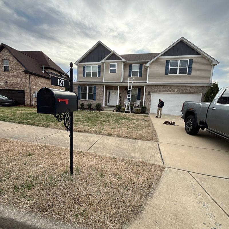 Roof shingles with ladder for hail damage inspection