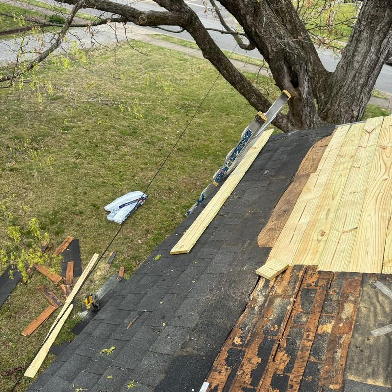 Asphalt shingle roof with wood decking replacement