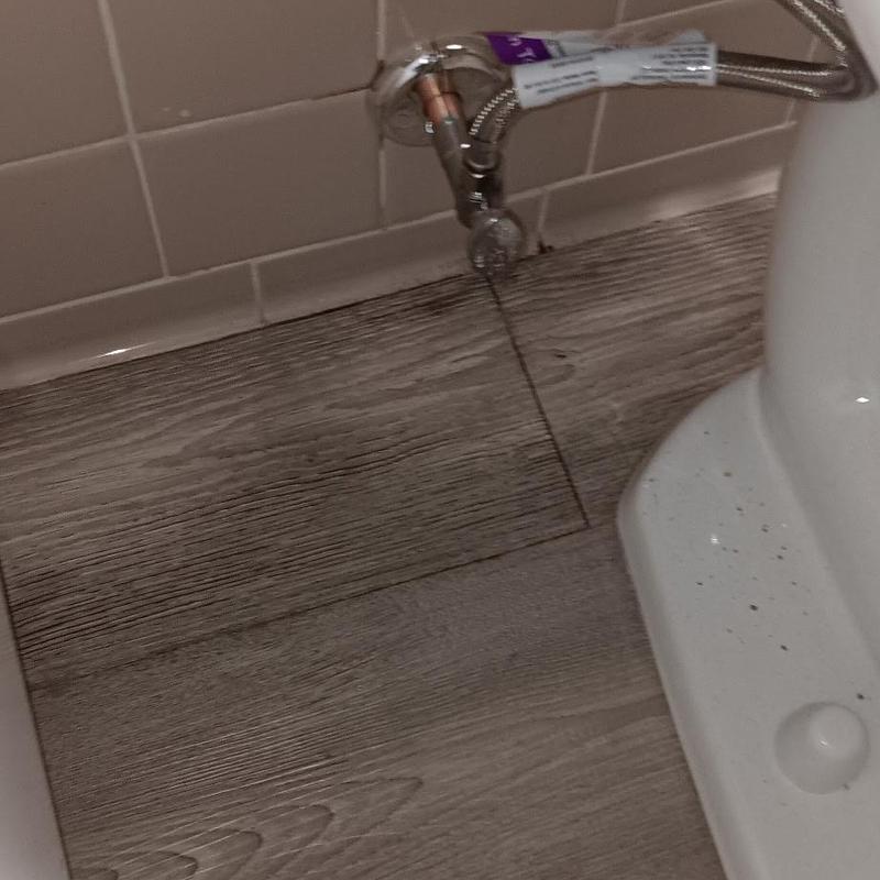 Toilet angle stop valve with braided supply line