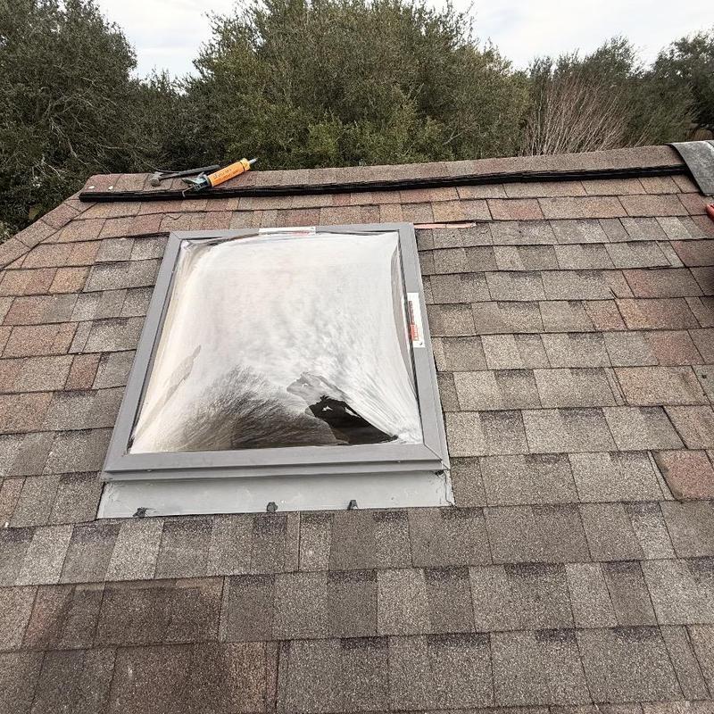 Skylight replacement and roof shingle repair