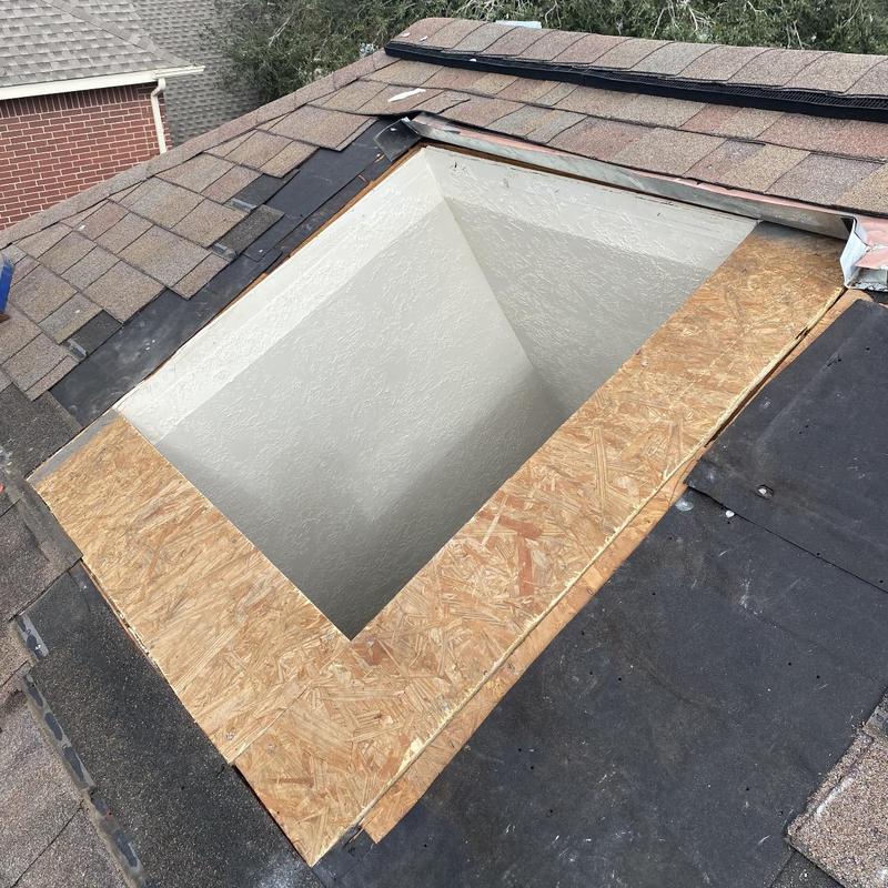 Skylight opening with plywood roof decking replacement