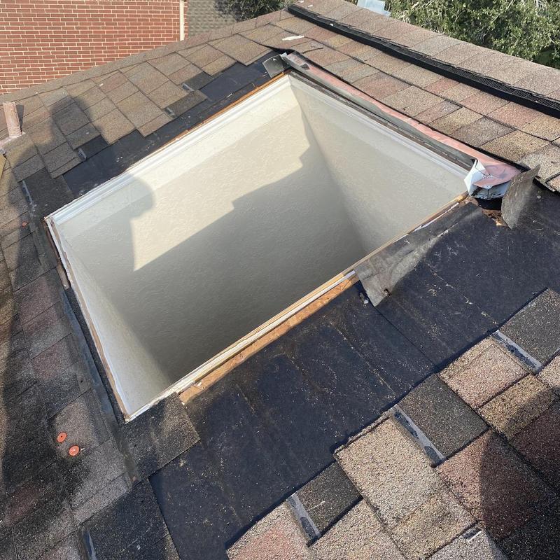Skylight frame and roof flashing repair on shingles