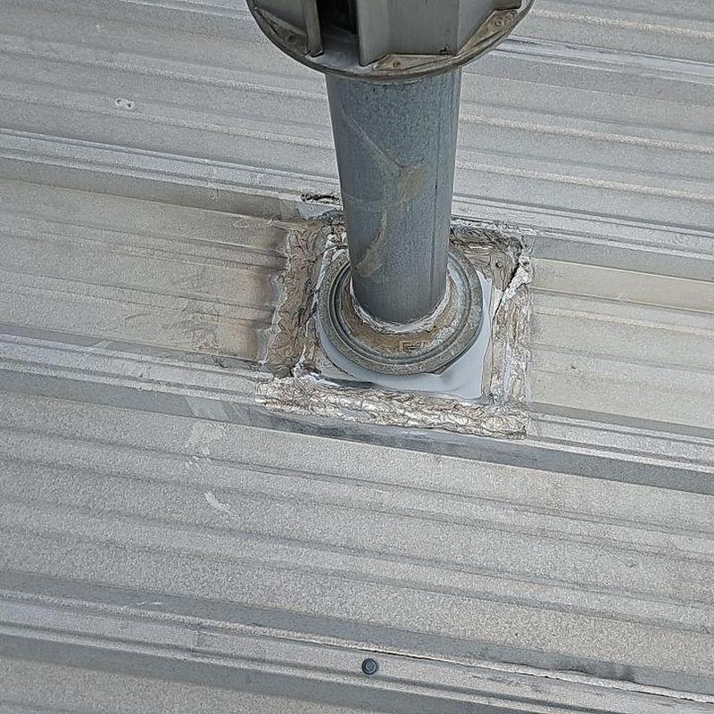 Metal roof pipe seal with silicone patch repairs Metal roof pipe seal with silicone patch repairs