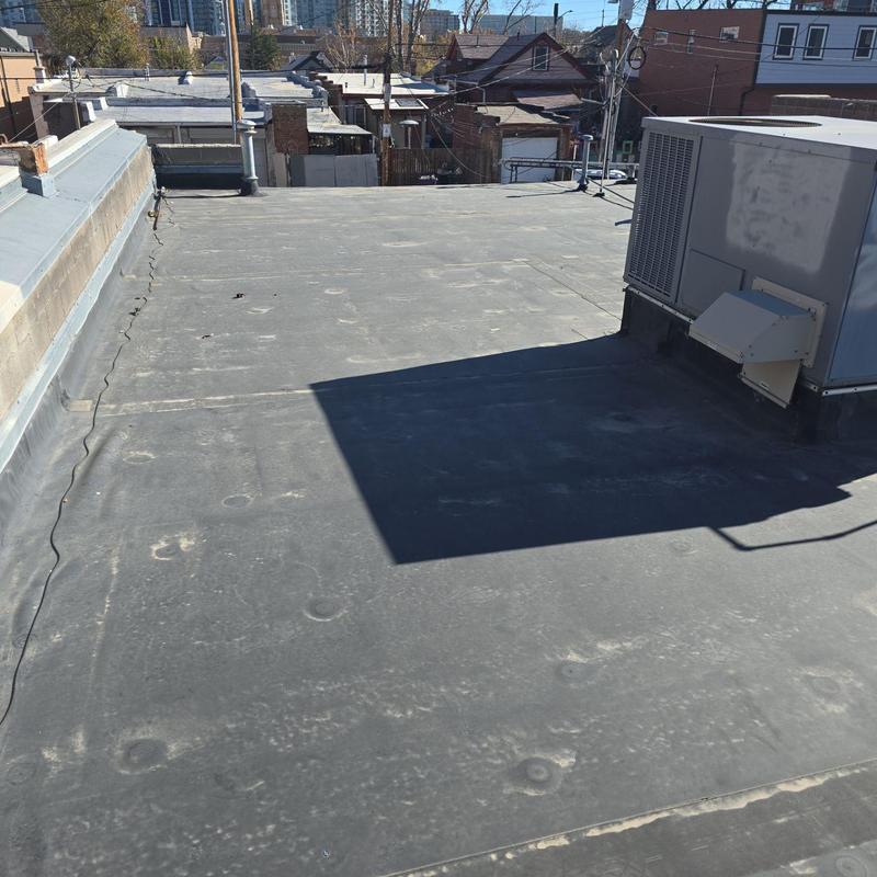 EPDM flat roof with HVAC unit resealing EPDM flat roof with HVAC unit resealing