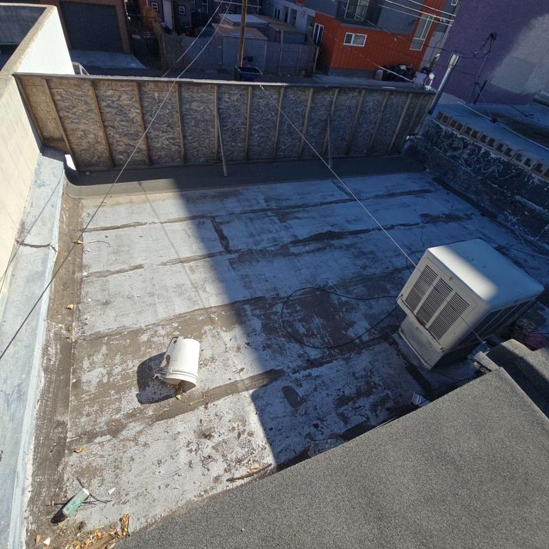 Modified bitumen flat roof with sealing and cap metal repairs Modified bitumen flat roof with sealing and cap metal repairs