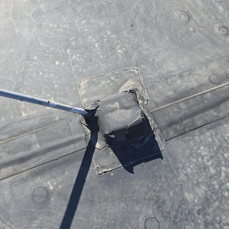 Flat roof pipe jack with resealed flashing detail Flat roof pipe jack with resealed flashing detail