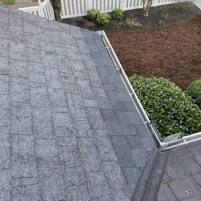 Step flashing installation along roof and wall edge