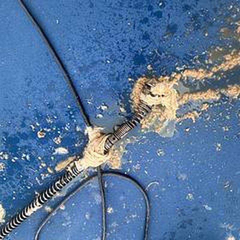 Power auger cable clearing cleanout on basketball court