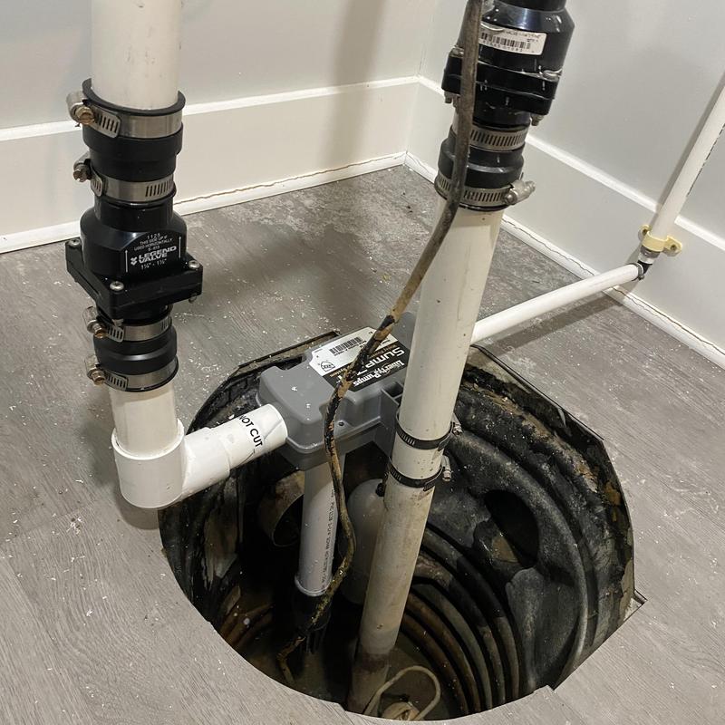 Water backup sump pump installation with PVC piping