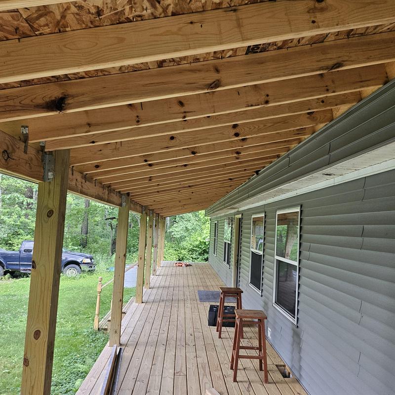 Porch decking and framing with new wood posts Porch decking and framing with new wood posts