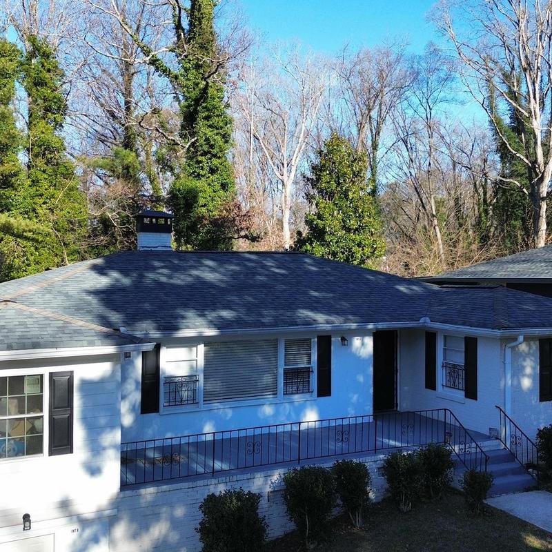 Asphalt shingle roof inspection with chimney view