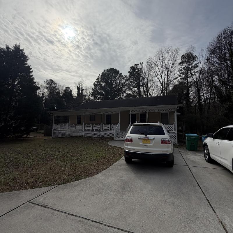 Roof shingles and detached gutter inspection at house