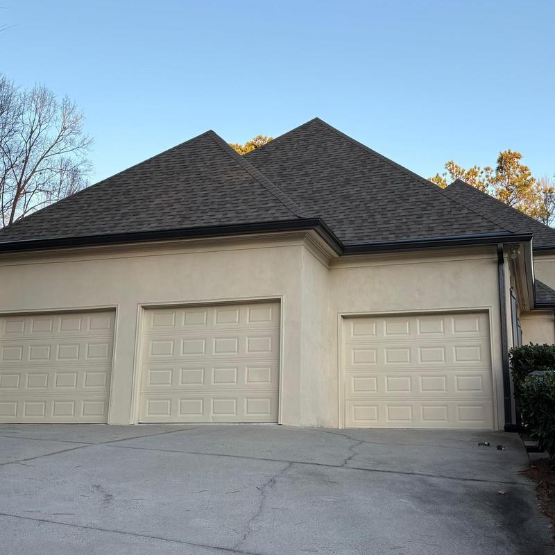 Gutter guards and fascia replacement on garage exterior