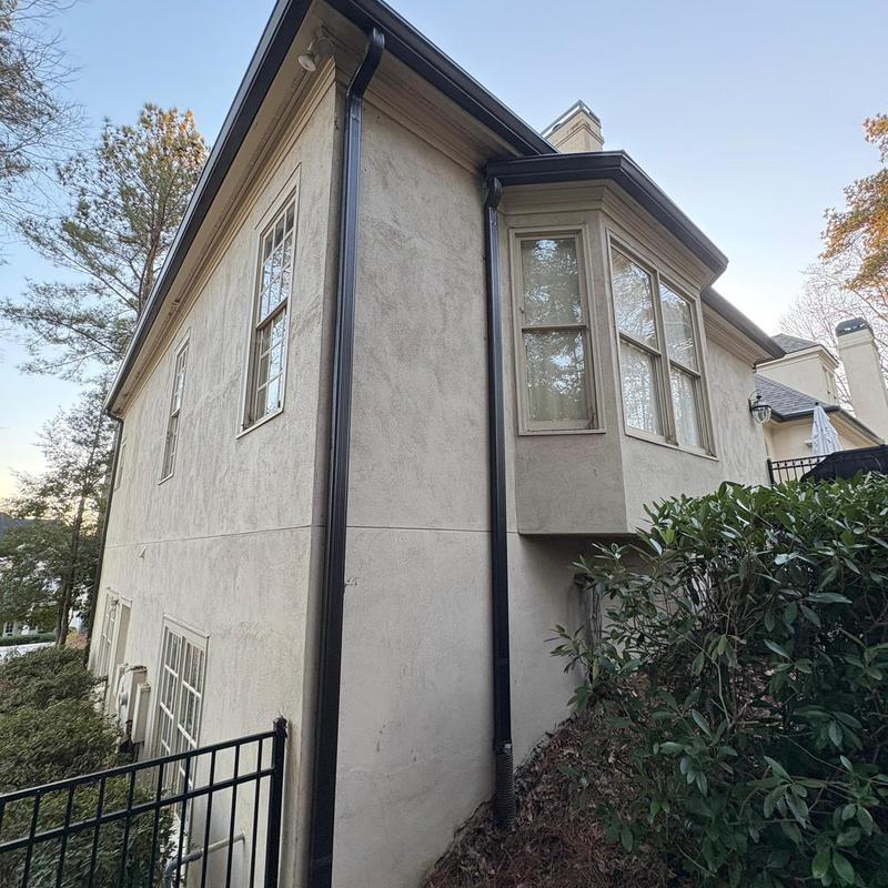 Gutter guards and fascia replacement on house exterior