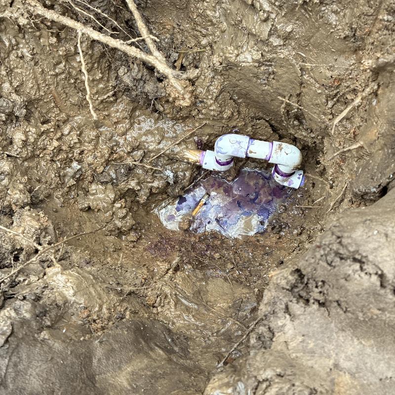 Three-quarter PVC expansion joint in muddy ground