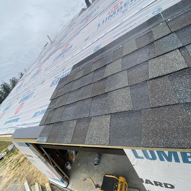 Roof shingle sample installed on new construction roof