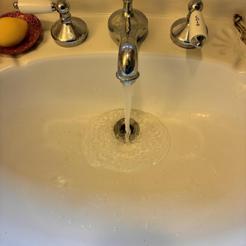 Kitchen sink drain clearing with flow testing