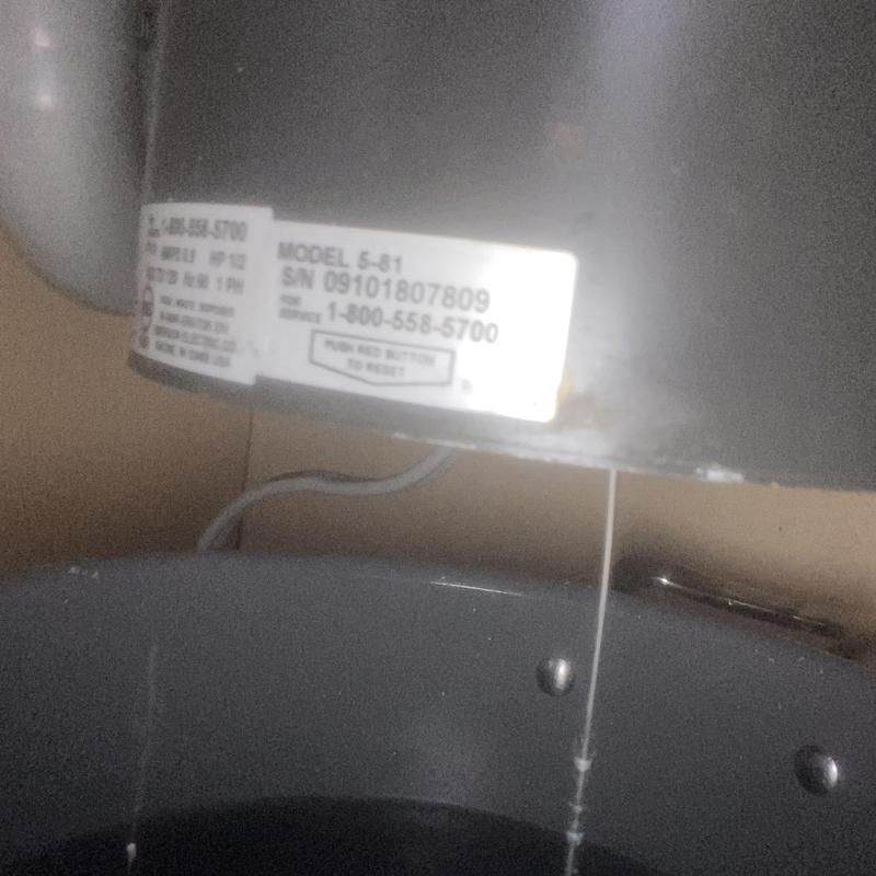 Garbage disposal unit with model and serial label