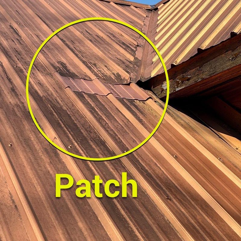 Metal roof patch with discoloration and rust marks