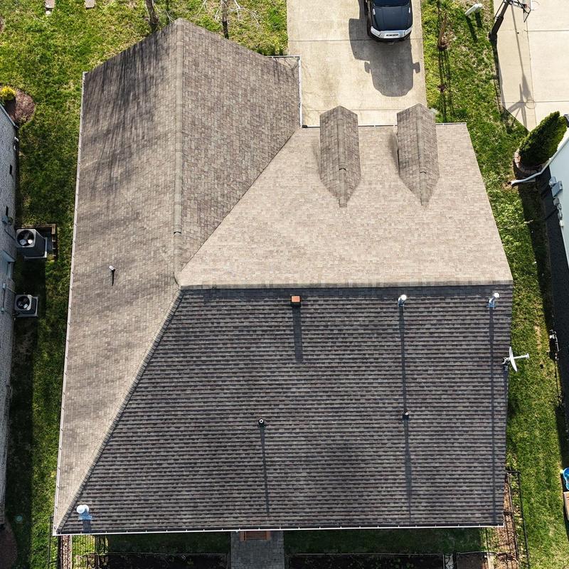 Asphalt shingle roof with hail damage inspection