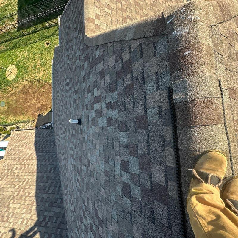 Asphalt shingle roof with hail damage inspection