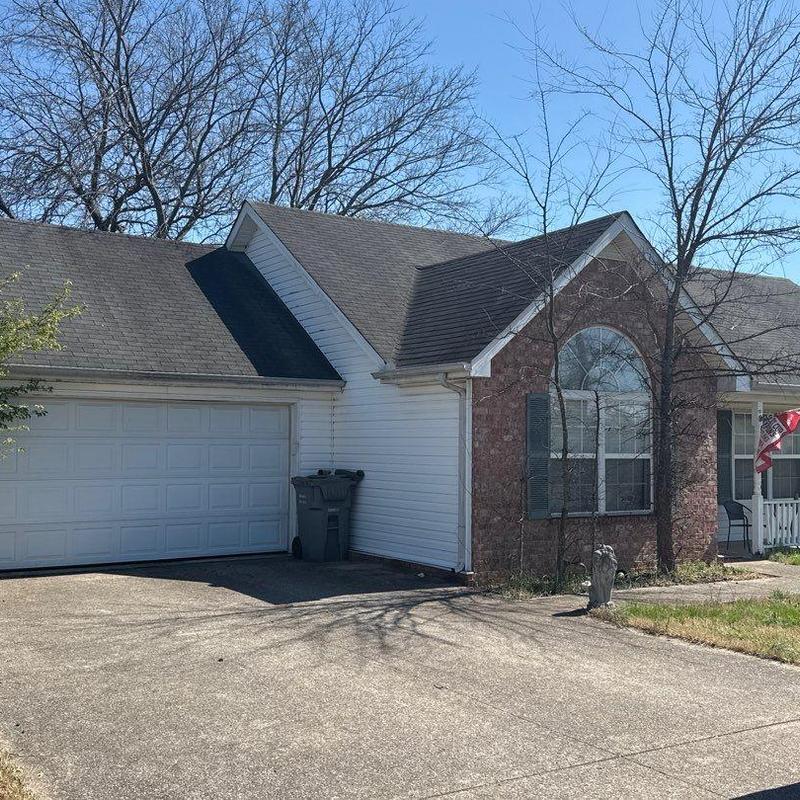 Asphalt shingle roof with hail damage inspection