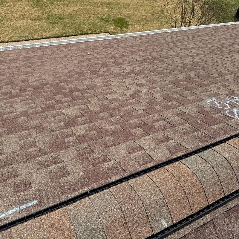 Asphalt shingle roof with hail damage markings