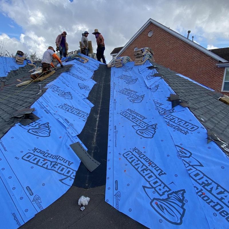 Synthetic underlayment installation on residential roof