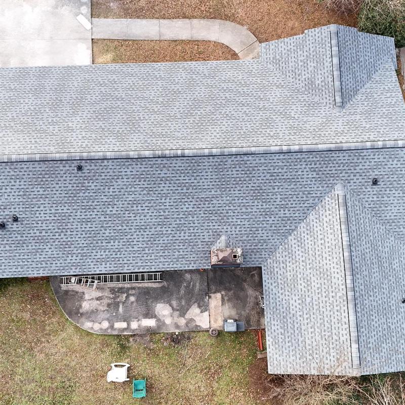 Asphalt shingle roof replacement with decking boards logged