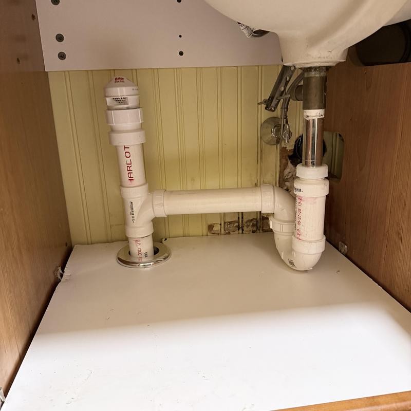 Bathroom sink drain repiping with new pipe route