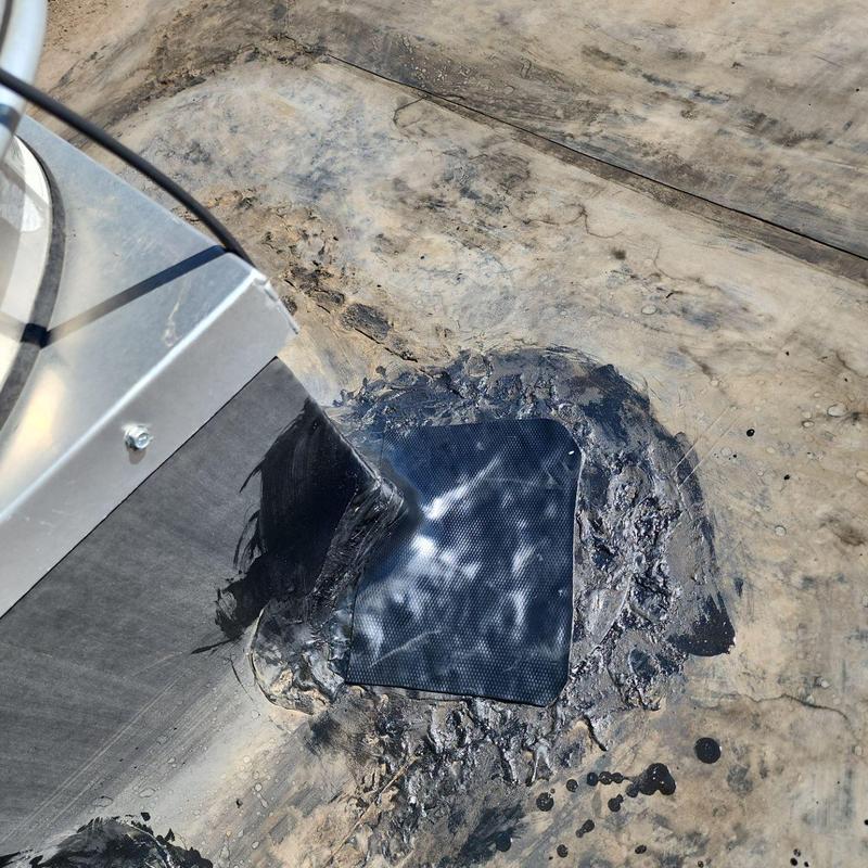 EPDM roof patch and sealing around metal pipe jack EPDM roof patch and sealing around metal pipe jack