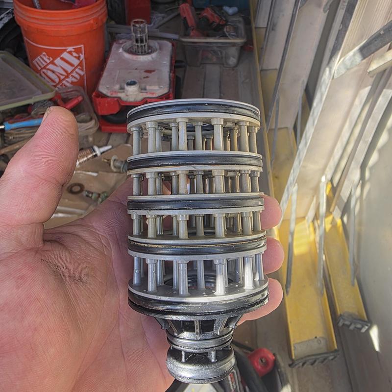 Water softener seal stack held in hand