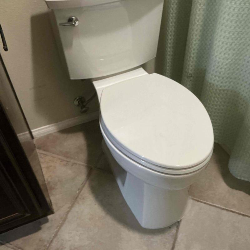 Toilet with new wax ring and water supply connections