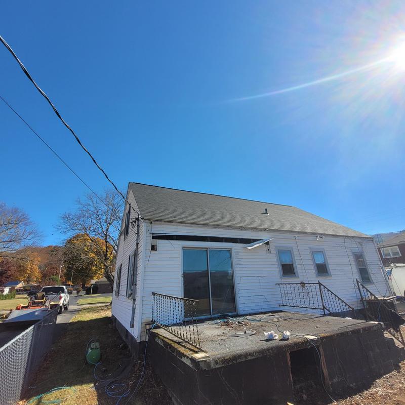 Roof installation on residential house exterior in Blountville