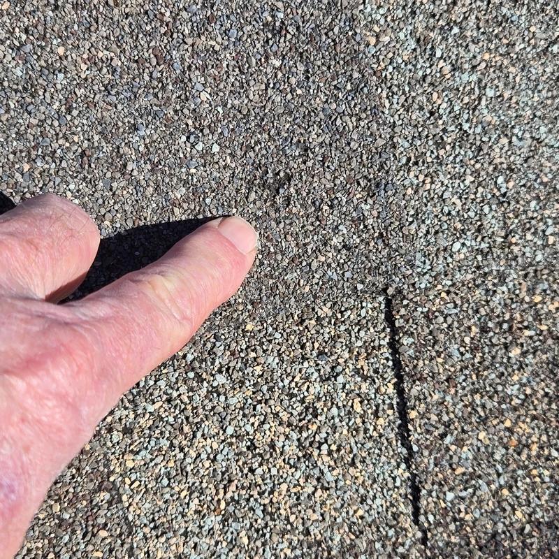 Asphalt shingle granule loss from hail damage