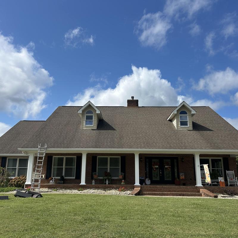 Roof replacement with new gutters and window seal