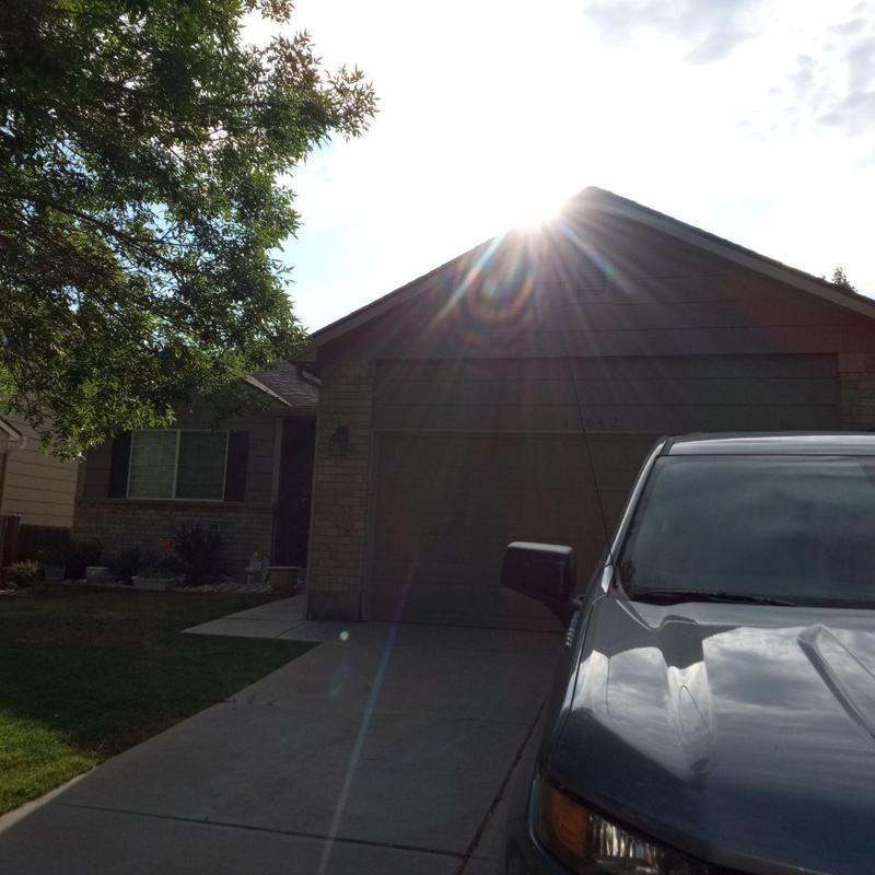 Shingle roof with sunlight glare, no hail damage Shingle roof with sunlight glare, no hail damage