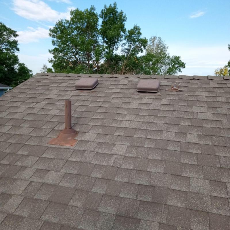Asphalt shingle roof with vents, clear of damage Asphalt shingle roof with vents, clear of damage