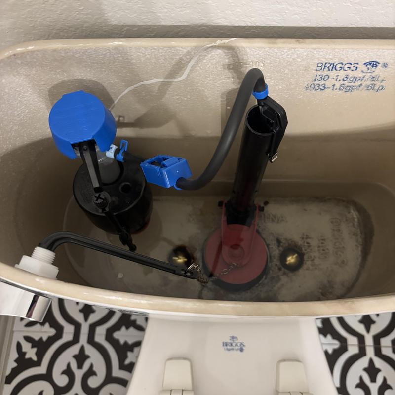 Toilet internal flush kit and fill valve inside tank