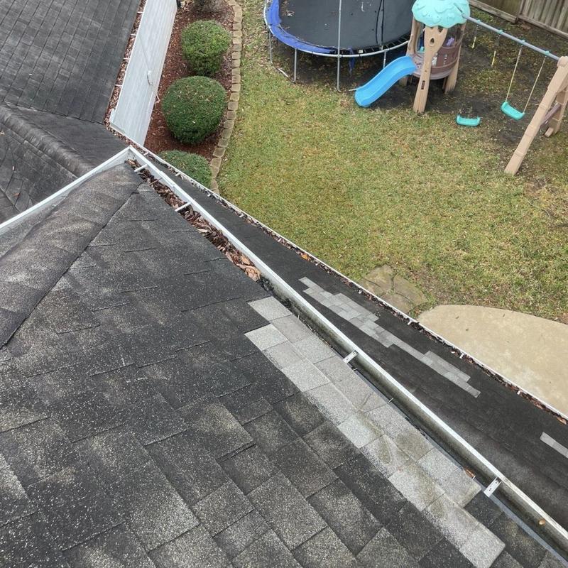 Asphalt shingle roof patch with repaired flashing