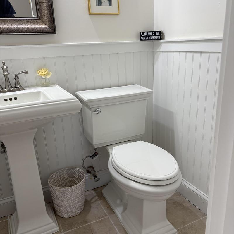 Toilet with rebuilt internal parts and relocated tank