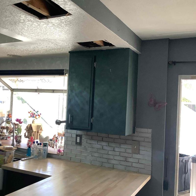 Pex pipe installation behind kitchen drywall wall