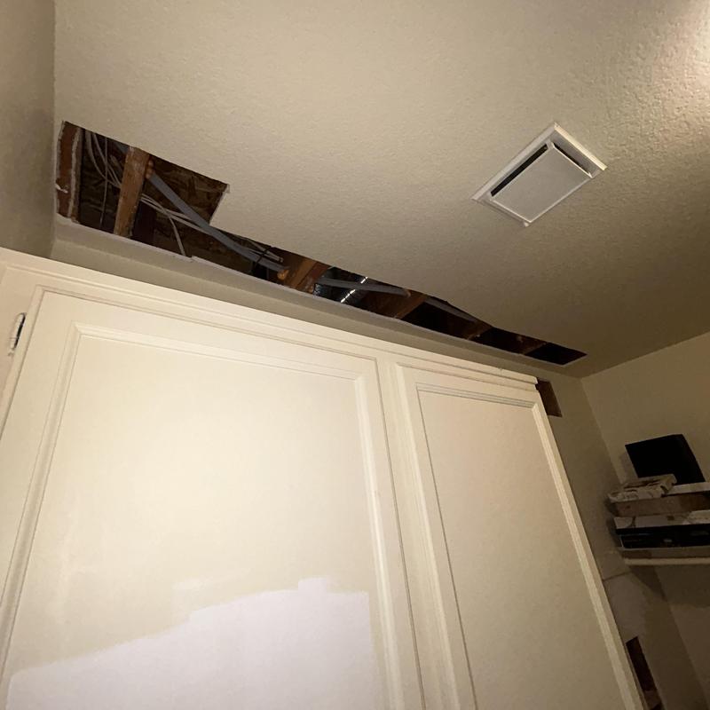 PEX piping installation behind ceiling drywall removed