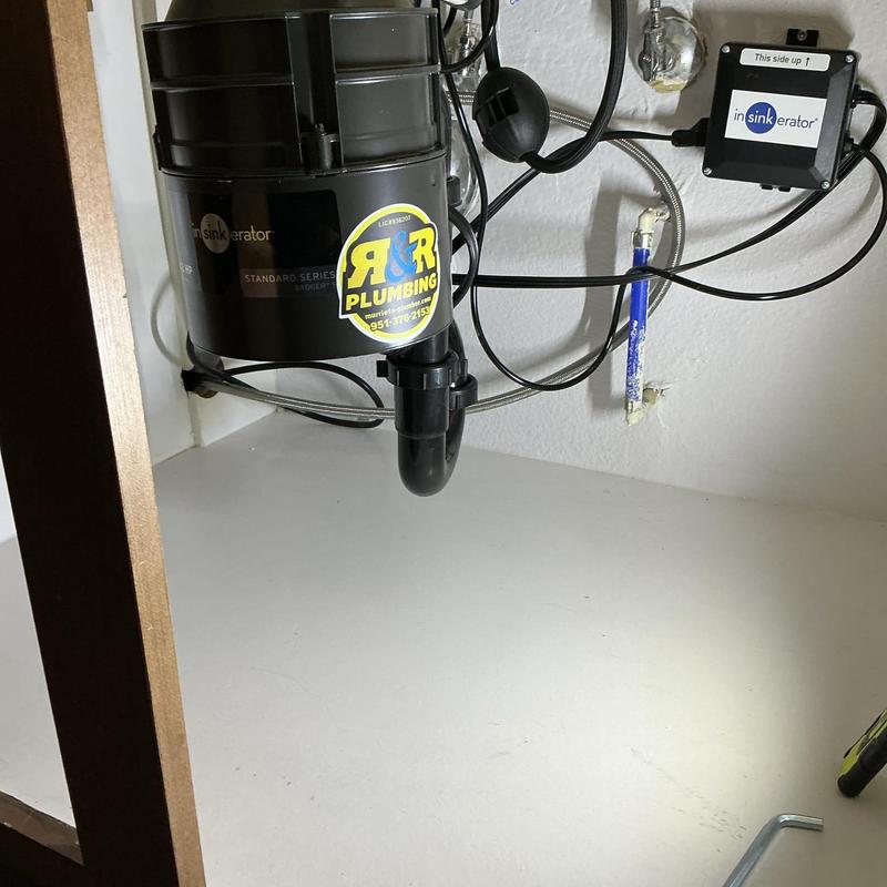 Garbage disposal with new matte black flange installed